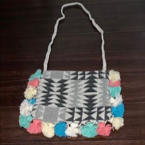 Roxy crossbody bag with fringe poms. NWOT.